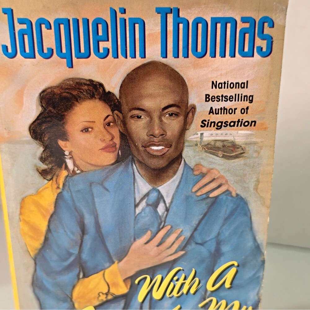 Jacquelin Thomas With A Paperback Romance Fiction Novel in English